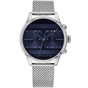 Tommy Hilfiger Cooper 1791596 men's watch featuring a silver stainless steel case, sleek blue dial with dual-time sub-dials, and mesh bracelet