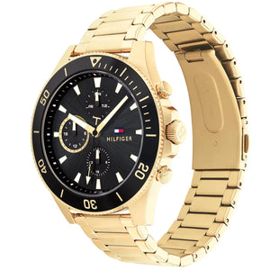 Angled real-life photo of Tommy Hilfiger 1791919 showing the gold case and black bezel