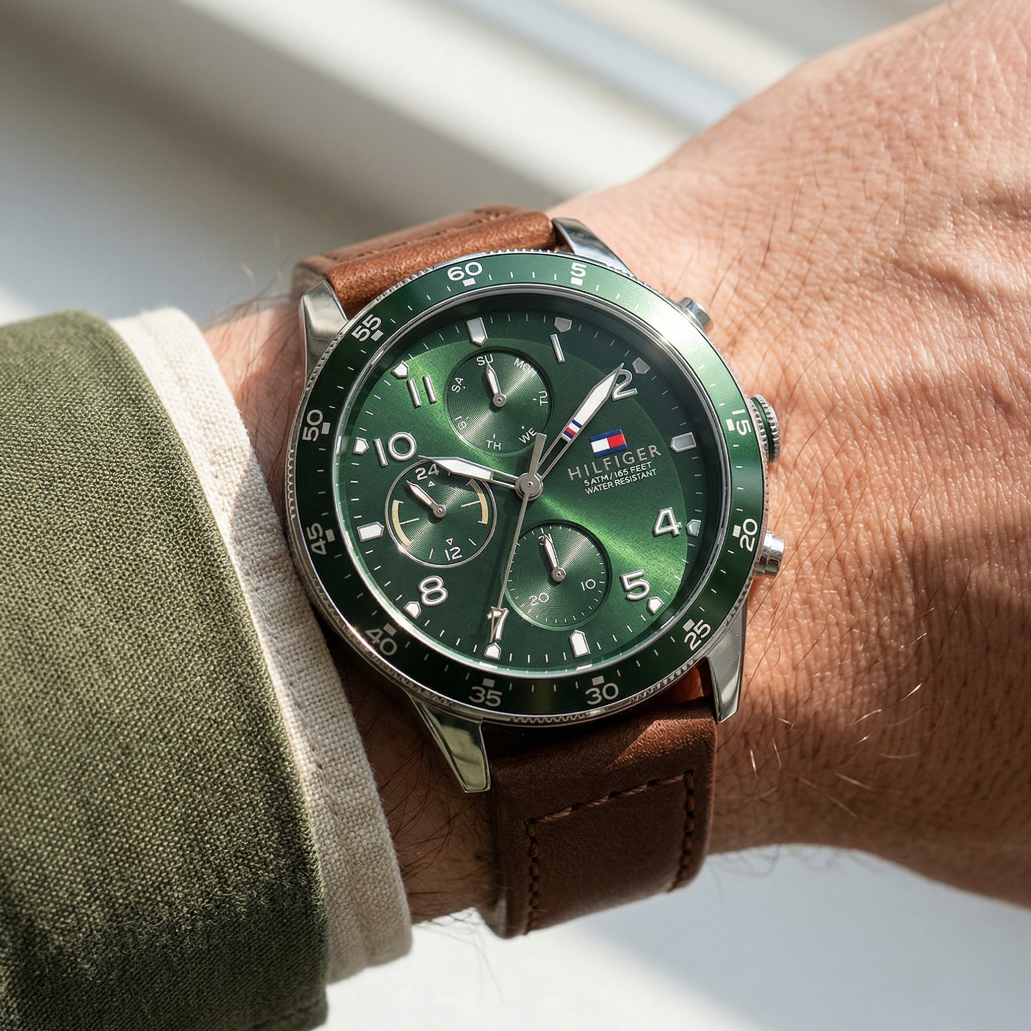 Close up shot of Tommy Hilfiger 1791948 on wrist showing green dial and sub-dial counters