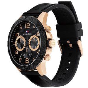 Angled real-life photo of Tommy Hilfiger 1792028 showing the rose gold case and black link texture