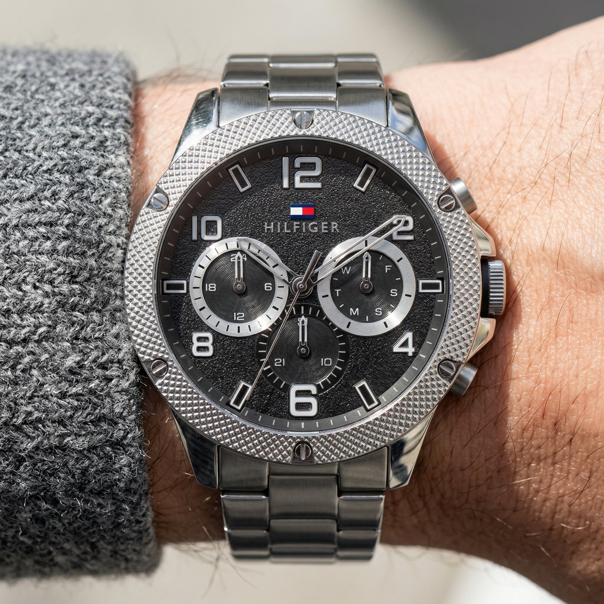 Close up shot of Tommy Hilfiger 1792029 on wrist showing black dial and multi-function sub-dials