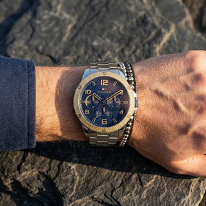 Close up shot of Tommy Hilfiger 1792031 on wrist showing blue dial and gold-tone sub-dial counters