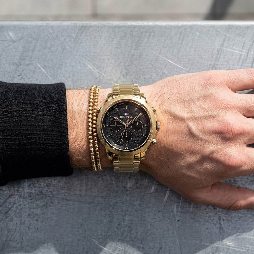 Close up shot of Tommy Hilfiger 1792109 on wrist showing black dial and timer bezel details