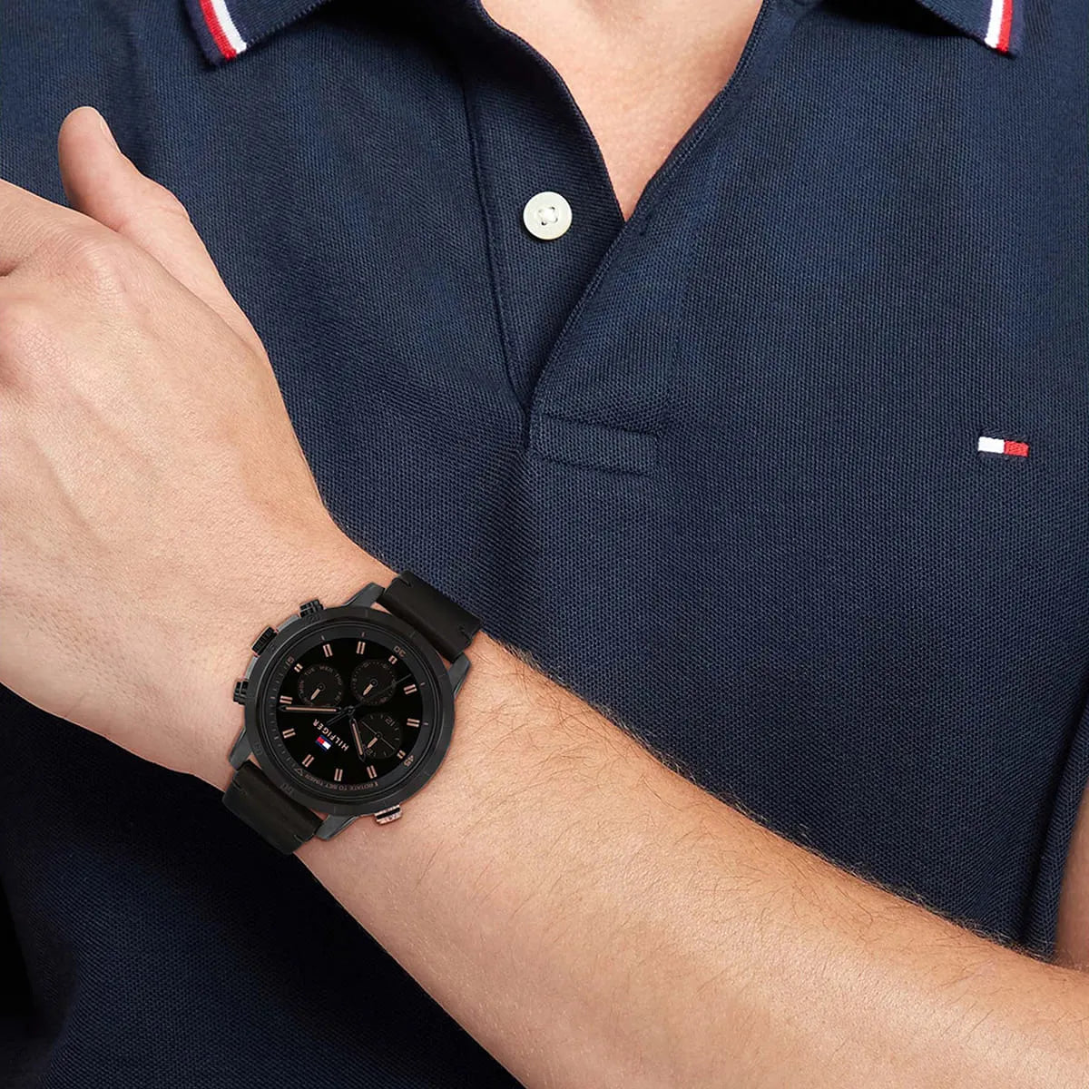 Close up shot of Tommy Hilfiger 1792110 on wrist showing black dial and rose gold details