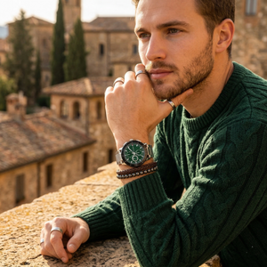 Elegant man wearing Tommy Hilfiger Lorenzo 1792117 men's quartz battery watch with silver-tone case and luxury green dial