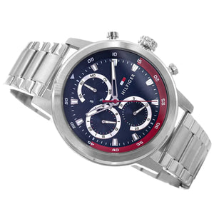 Silver watch with a blue and red face on a white background