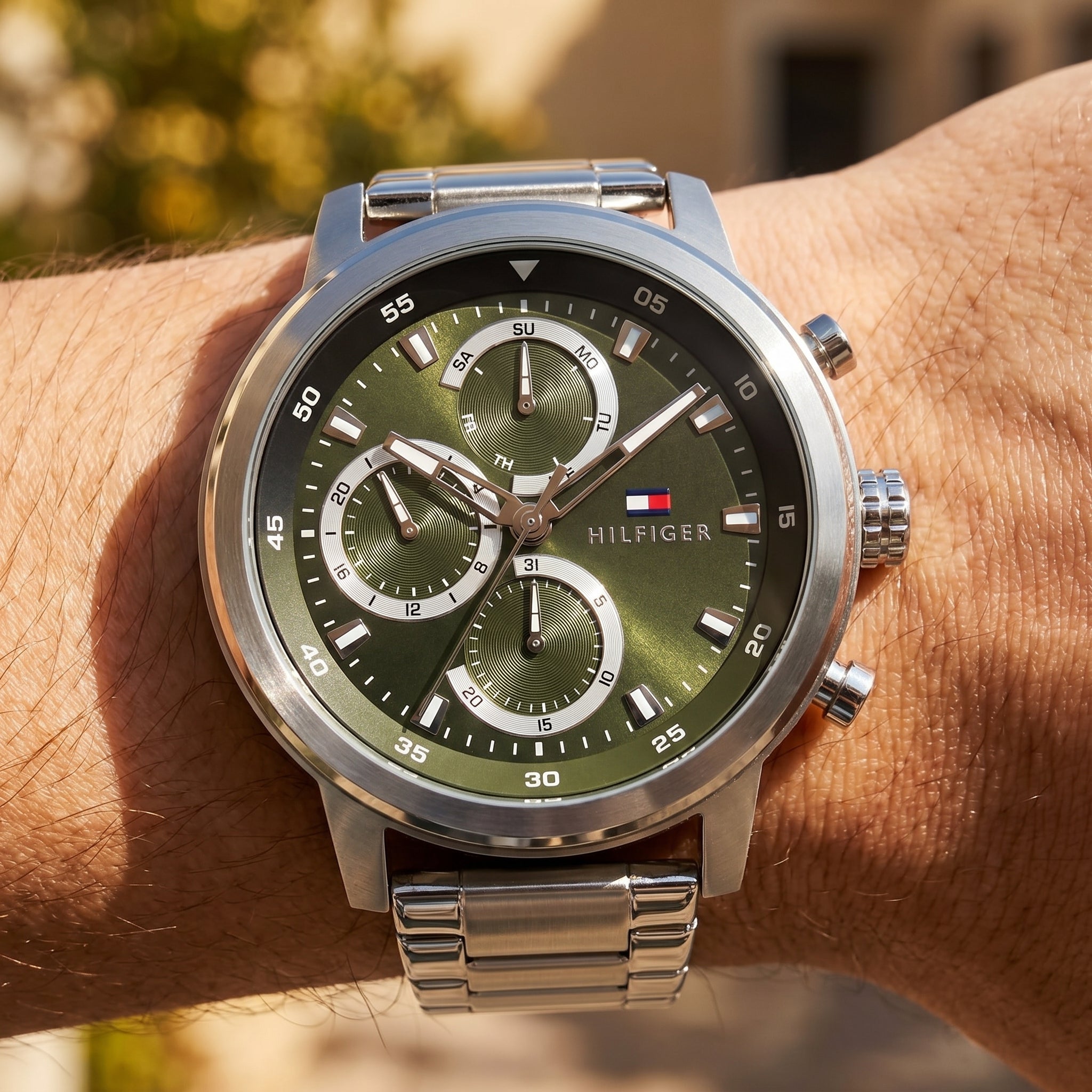 Close up shot of Tommy Hilfiger 1792180 on wrist showing the large silver case and multifunction dial