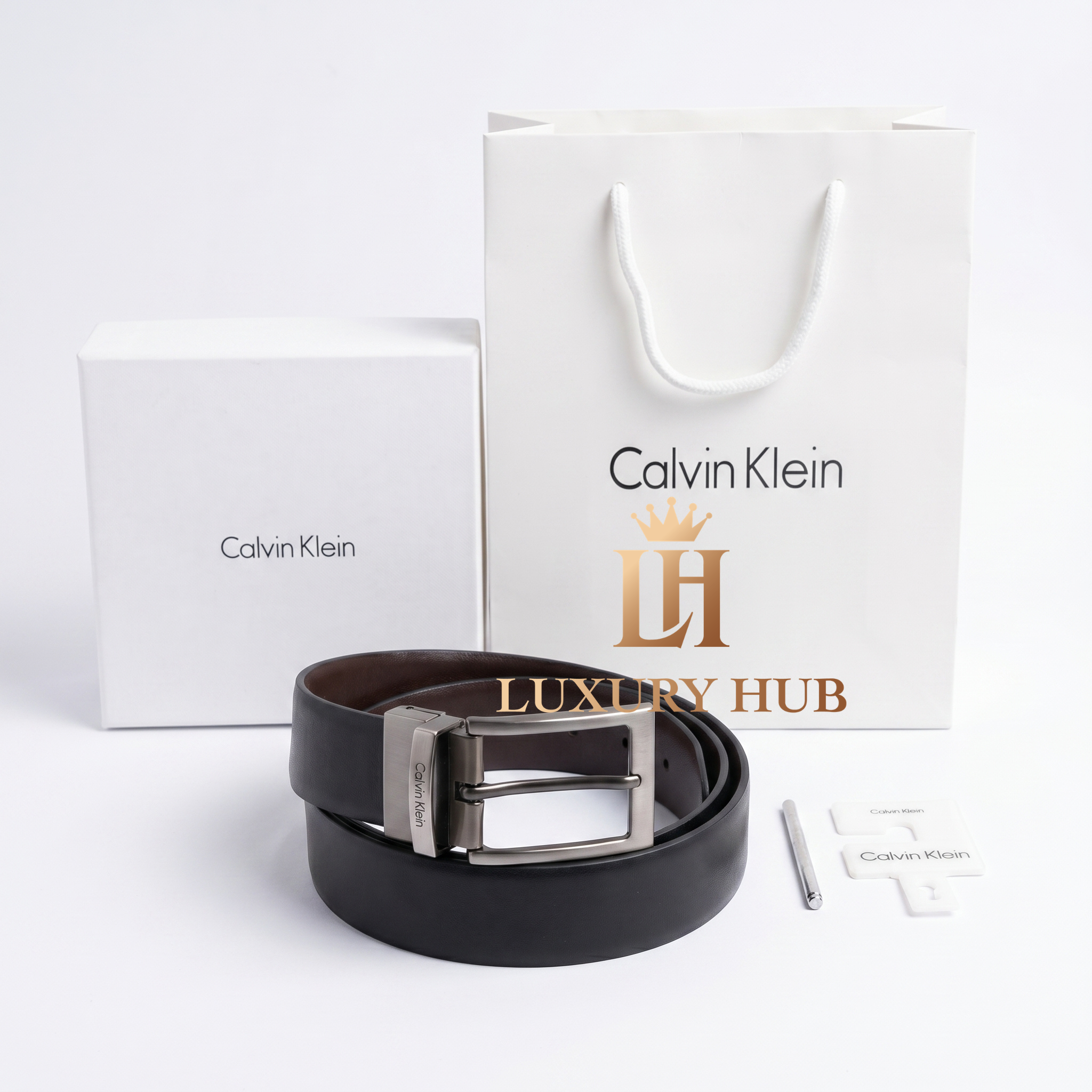 Calvin Klein double-face belt display showing both the black and brown premium leather sides