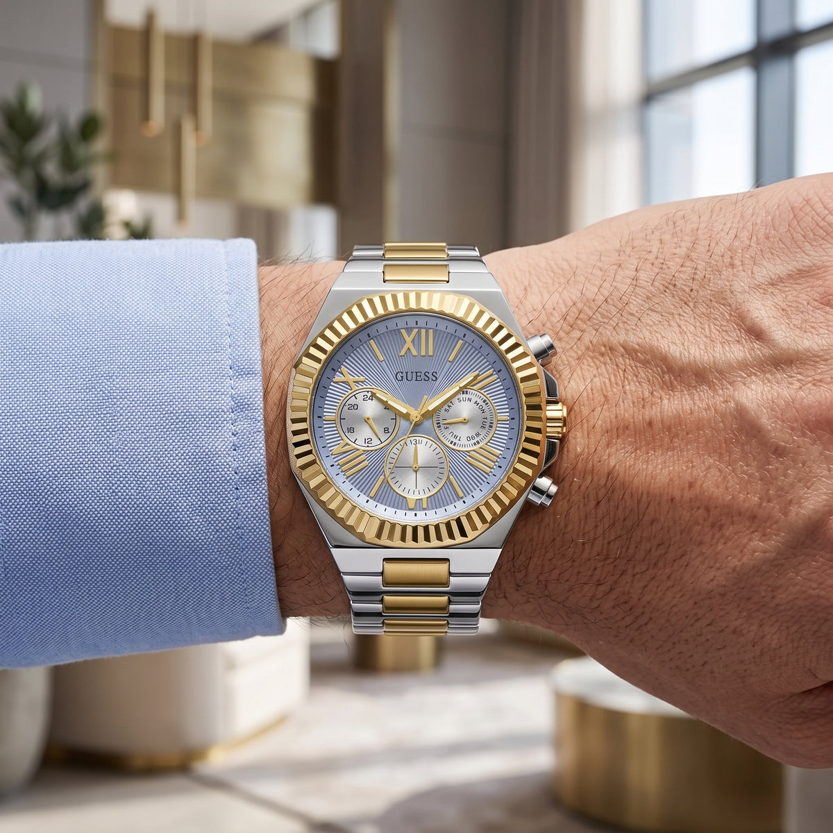 Guess GW0703G3 Equity men's two-tone stainless steel multifunction watch with blue dial on wrist