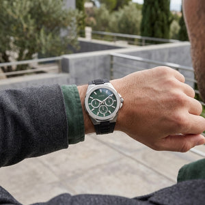 Guess GW0799G3 Dashboard men's silver multifunction watch with green dial and black silicone strap on wrist