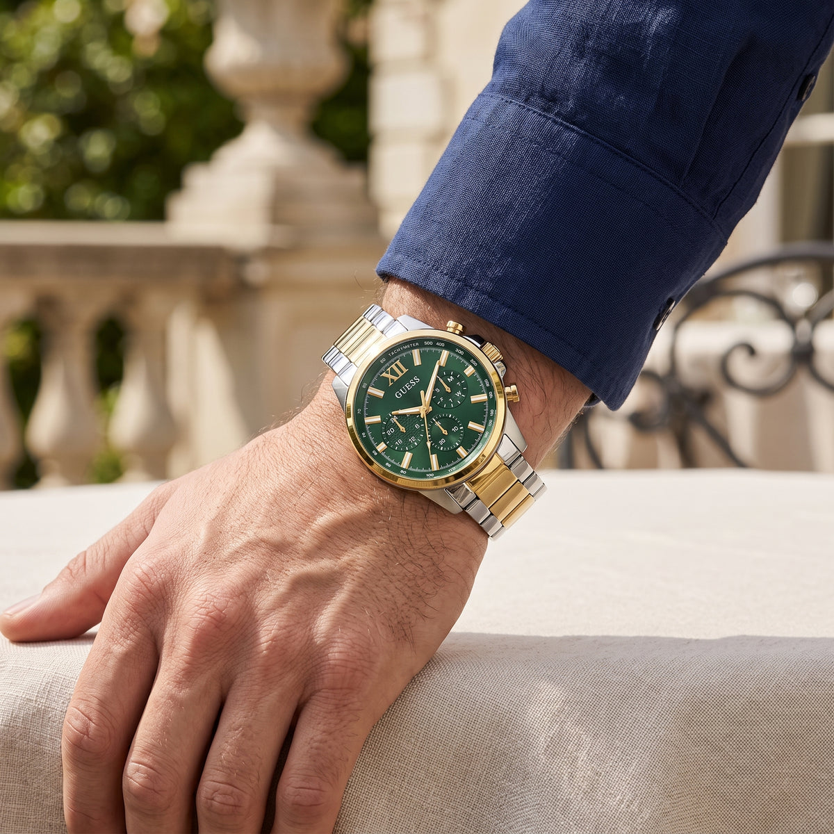Guess GW0900G5 Walker men's two-tone stainless steel multifunction watch with green dial on wrist