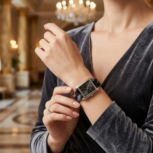 Close up shot of Michael Kors MKo1199 on wrist showing black dial and silver-tone Roman numerals