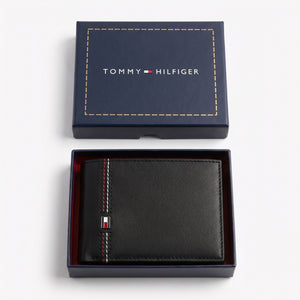 Internal layout view of the Tommy Hilfiger leather bi-fold wallet showcasing organized card slots and signature color stripe detail