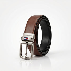 Brown leather belt with silver buckle on a white background