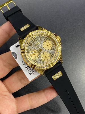 Real-life photo of Guess W1160L1 watch in hand showing actual size and shine