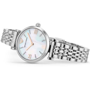 Silver watch with a detailed face on a white background