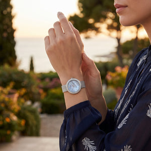 Female model wearing Emporio Armani Rosa silver mesh watch for an elegant luxury look