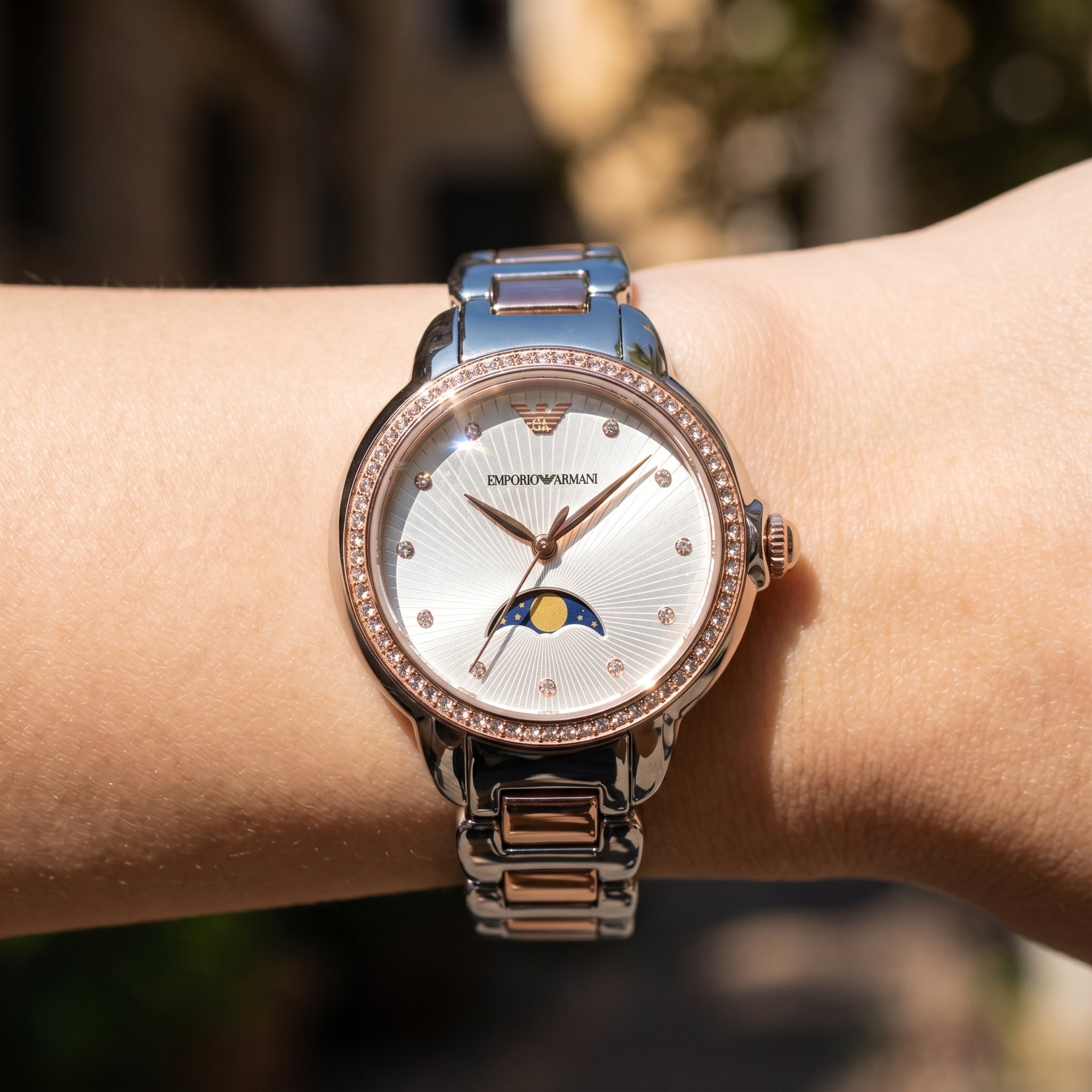 Close up shot of AR11567 highlighting the textured silver dial with moonphase window and crystal markers
