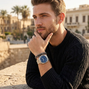 Elegant man wearing Emporio Armani Carlo AR11688 men's quartz battery watch with silver cushion case and luxury navy blue dial