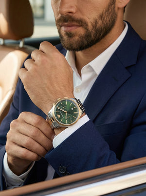 Lifestyle photo of Emporio Armani Dario AR11692 showing the bold two-tone watch on a man's wrist
