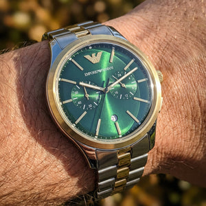Close up shot of Emporio Armani Dario AR11692 on wrist showing green dial and chronograph sub-dials