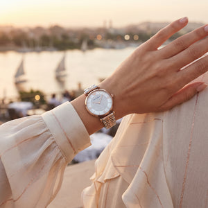 Female model wearing Emporio Armani Gianni T-Bar two-tone watch for a glamorous luxury look