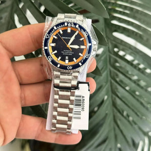 Close-up of the polished silver Emporio Armani eagle logo on the AR60090 blue sunray dial