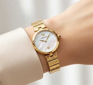 Sophisticated woman wearing Emporio Armani AR11198 silver mesh watch with grey sweater