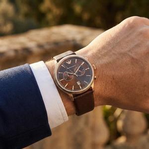 Man wearing Emporio Armani AR1793 rose gold and brown watch with formal suit