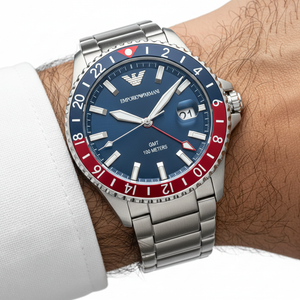 Close up of the AR11590 dial showing the red GMT hand and the bi-directional Pepsi bezel