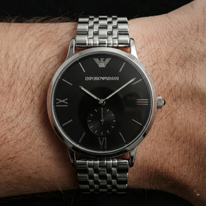 Close up of Armani AR1676 black dial showing Roman numerals and small seconds sub-dial