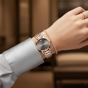 Modest woman wearing Emporio Armani AR1725 two-tone watch with silver silk blouse