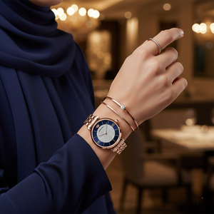 Elegant woman wearing Emporio Armani AR11423 rose gold watch with navy dress and accessories