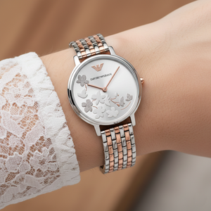 Extreme wrist macro of Armani AR11113 showing raised floral and butterfly dial details