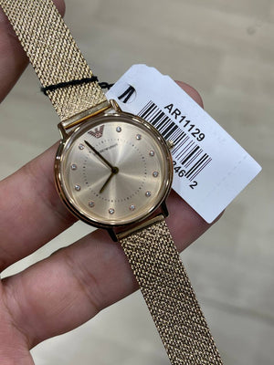 Emporio Armani Kappa AR11129 on wrist showing radiant gold and crystal sparkle