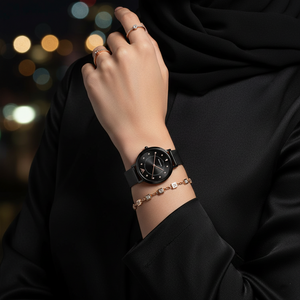 Woman wearing Emporio Armani AR11252 black mesh watch with crystal dial