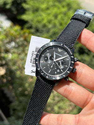 Emporio Armani Mario AR11453 all-black watch on wrist showing sporty style