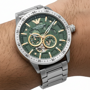 Close up of the AR60053 green skeleton dial showing the gold-tone gears and automatic movement