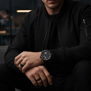 Detailed shot of the high-contrast white hands and markers on the black Armani AR60054 dial