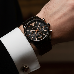 Extreme wrist macro of Armani AR70002 showing CERAMICA text on dial and rose gold hands