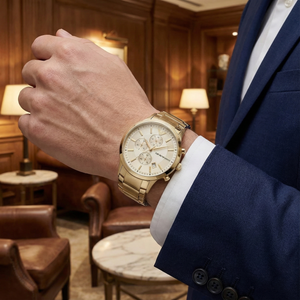 Wealthy man wearing Emporio Armani AR11332 gold watch with navy blue suit