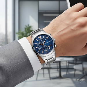 Stylish man wearing Emporio Armani AR11458 blue and rose gold watch with grey suit
