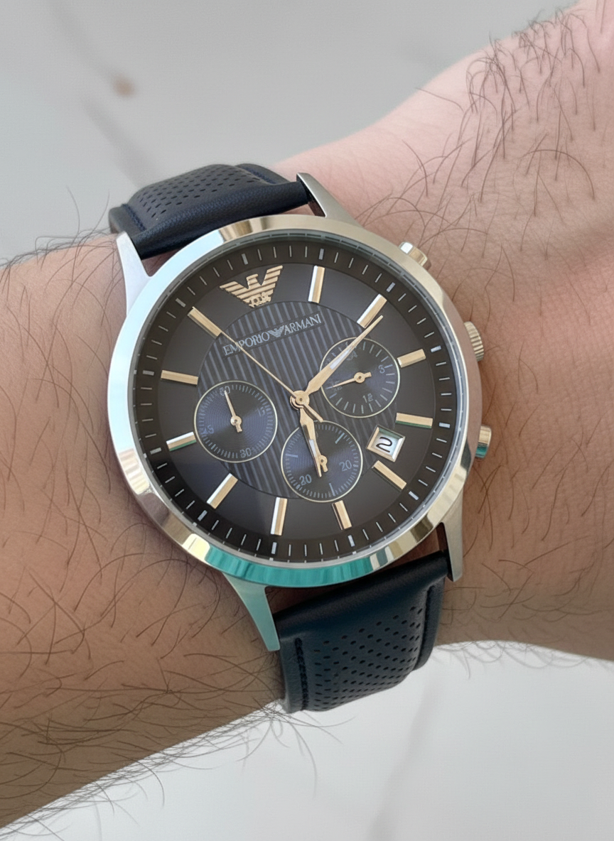 Close up of Armani AR2473 showing vertical striped blue dial and silver hands