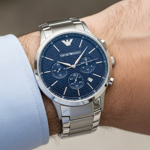 Extreme wrist macro of Armani AR2486 showing intricate geometric pattern on blue dial