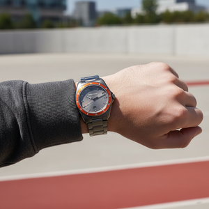 Sporty man wearing Emporio Armani AR11178 gunmetal and orange watch with hoodie