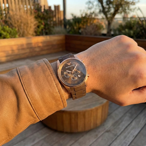 Stylish man wearing Emporio Armani AR5890 brown silicone and rose gold watch