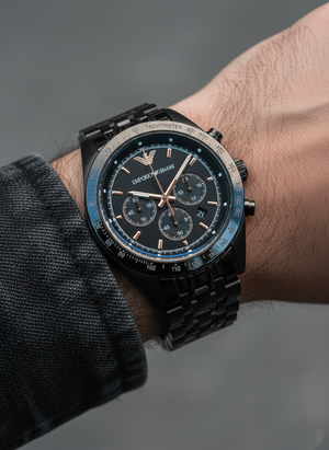 Extreme wrist macro of Armani AR5989 showing black PVD steel links and tachymeter