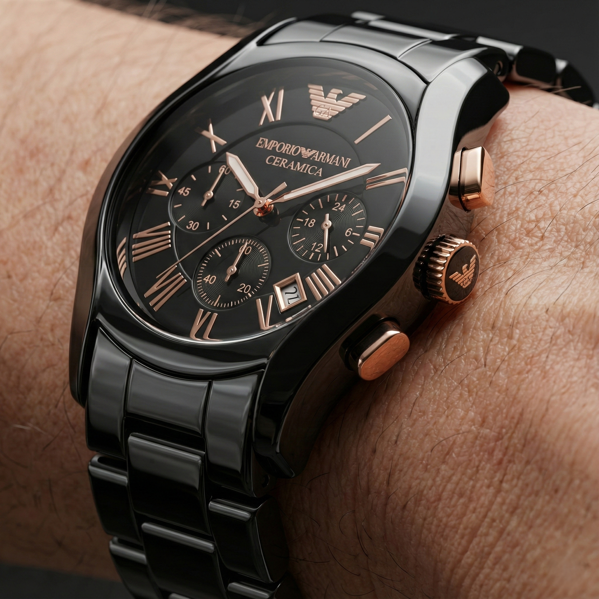 Close up of Armani AR1410 showing CERAMICA logo and rose gold roman numerals