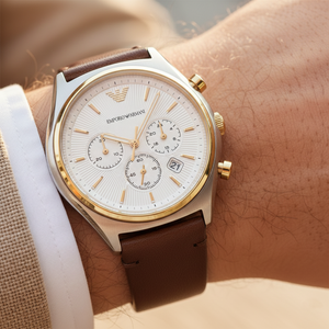 Extreme wrist macro of Armani AR11033 showing white textured dial and gold indices