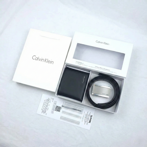 Calvin Klein wallet and belt set in packaging on a light gray background